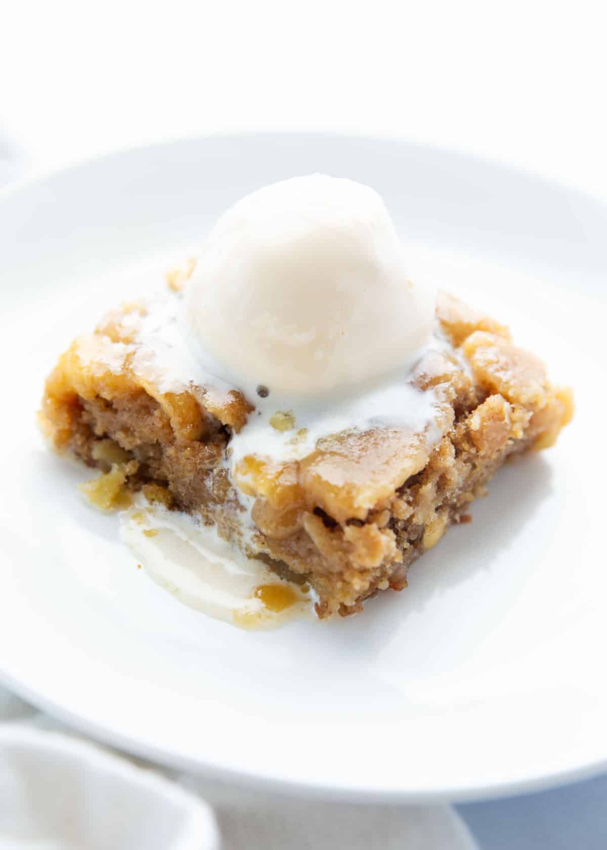 Apple cake on a white plate.