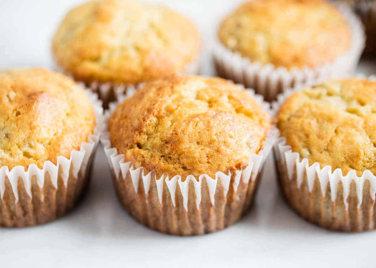 Banana bread muffins lined up together. 