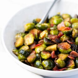 Brussel sprouts with bacon in a bowl.