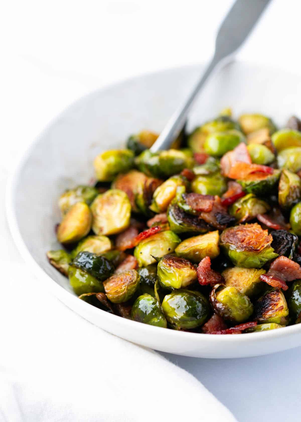 Brussel sprouts with bacon in a bowl.