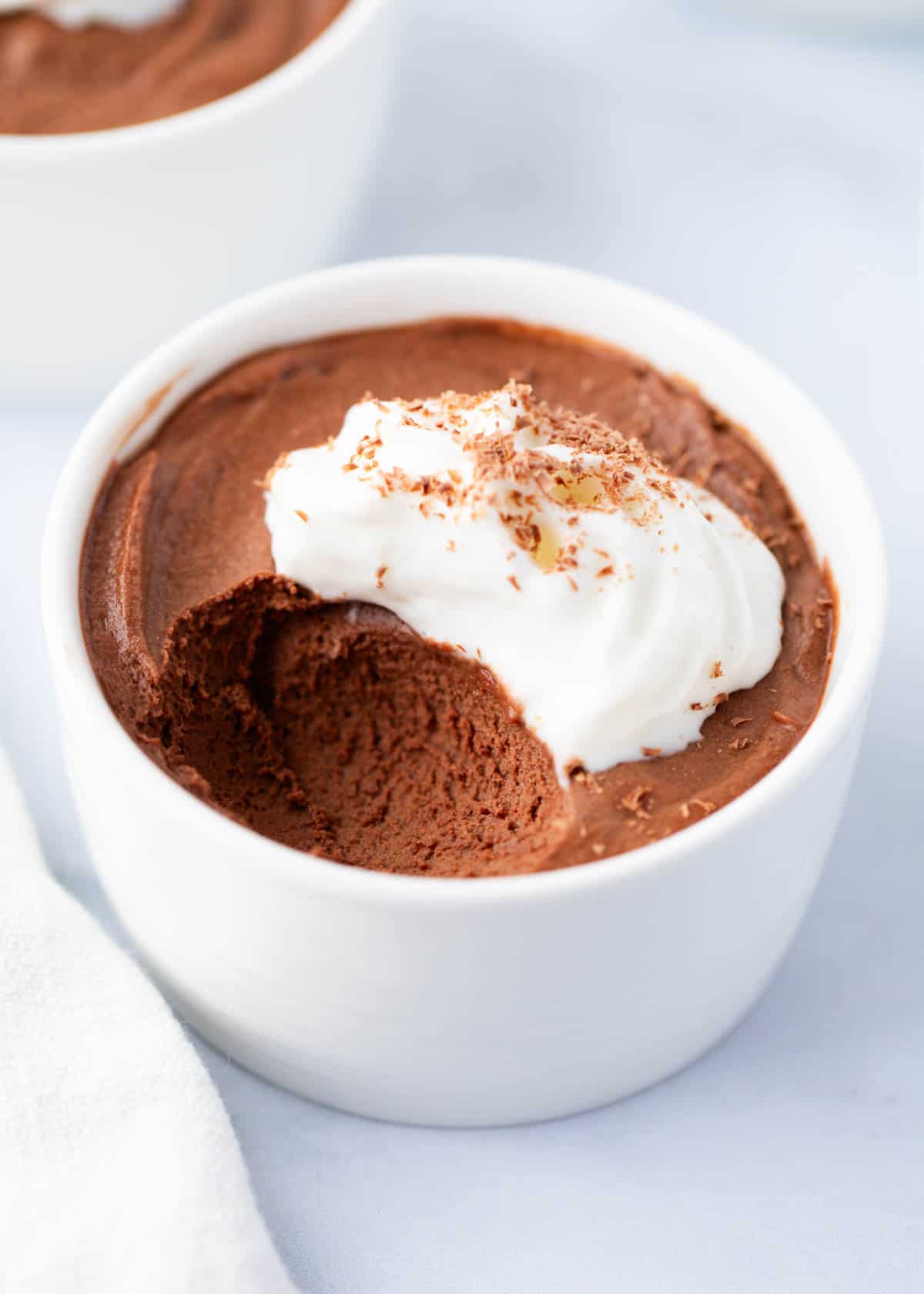 Chocolate mousse in a white bowl.