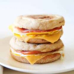 Egg mcmuffins on a plate.
