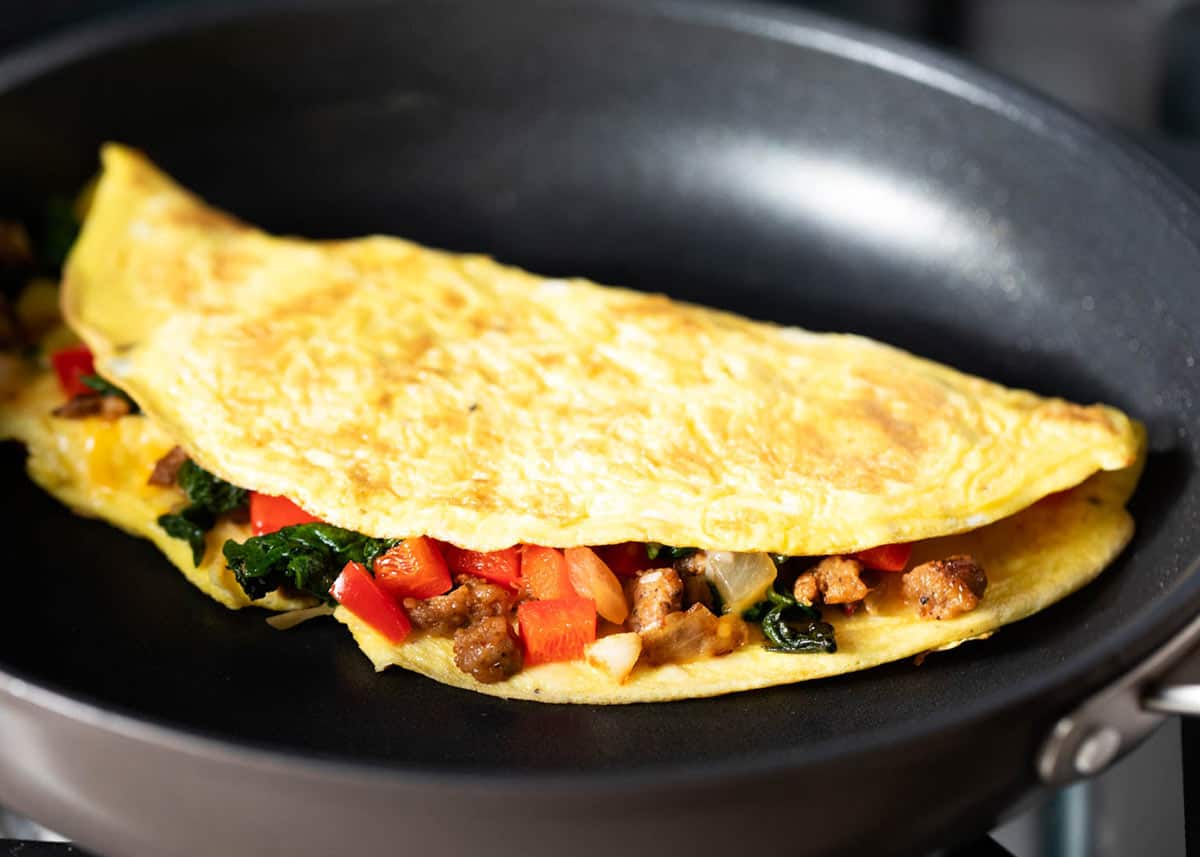 Omelette in a black frying pan. 