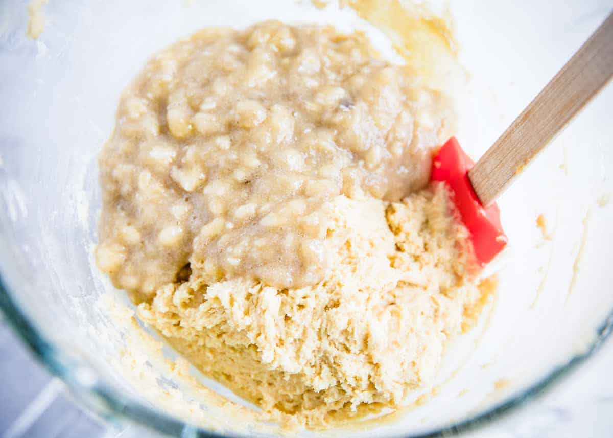 Banana bread muffin ingredients in a glass bowl. 