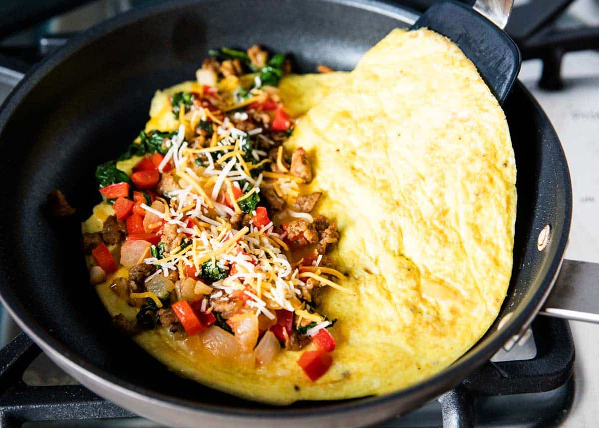 Cooking an omelette in a frying pan. 