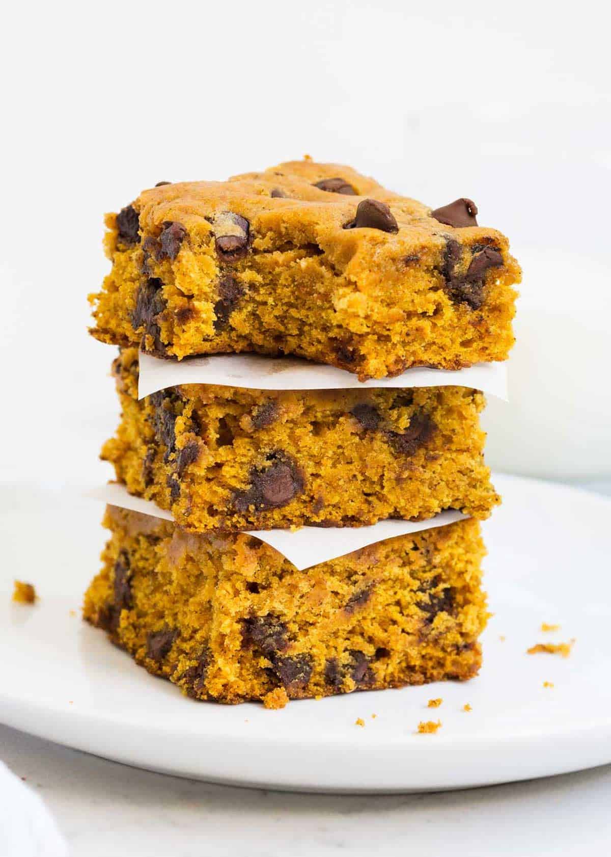 Pumpkin blondies stacked on top of each other. 