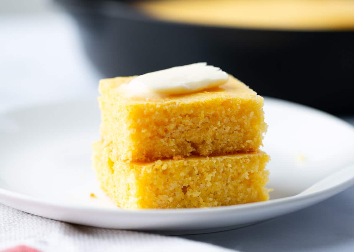 Sliced skillet cornbread on a plate.