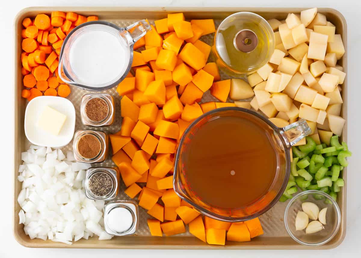 Butternut squash soup ingredients on a pan.