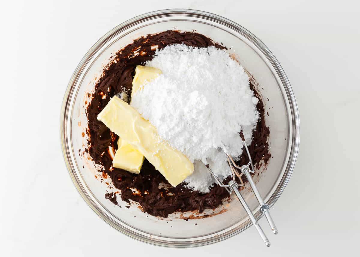 Chocolate frosting ingredients in a bowl.