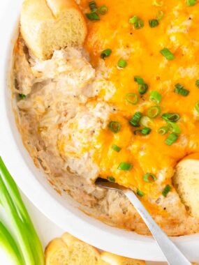 Spoonful of crab dip in pan.