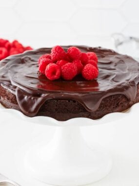 Flourless chocolate cake with raspberries on top.