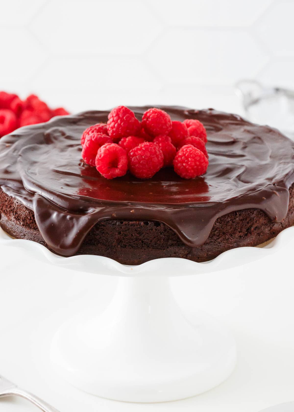 Flourless chocolate cake with raspberries on top.