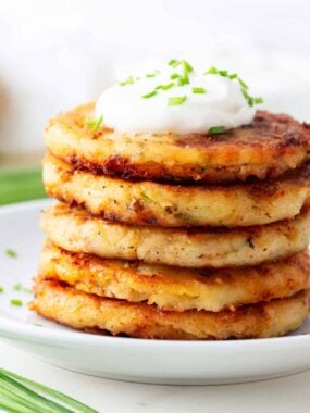 Stack of mashed potato pancakes on a plate.