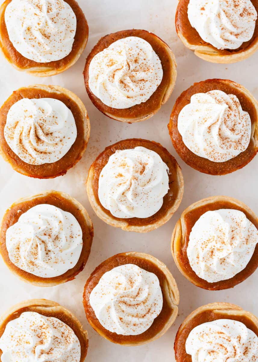 Mini pumpkin pies with whipped cream.