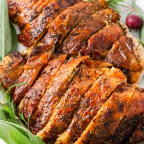 Sliced turkey breast on a plate.