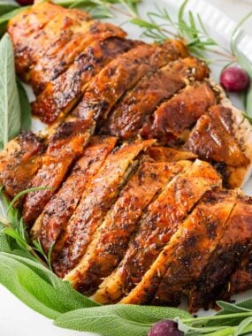 Sliced turkey breast on a plate.