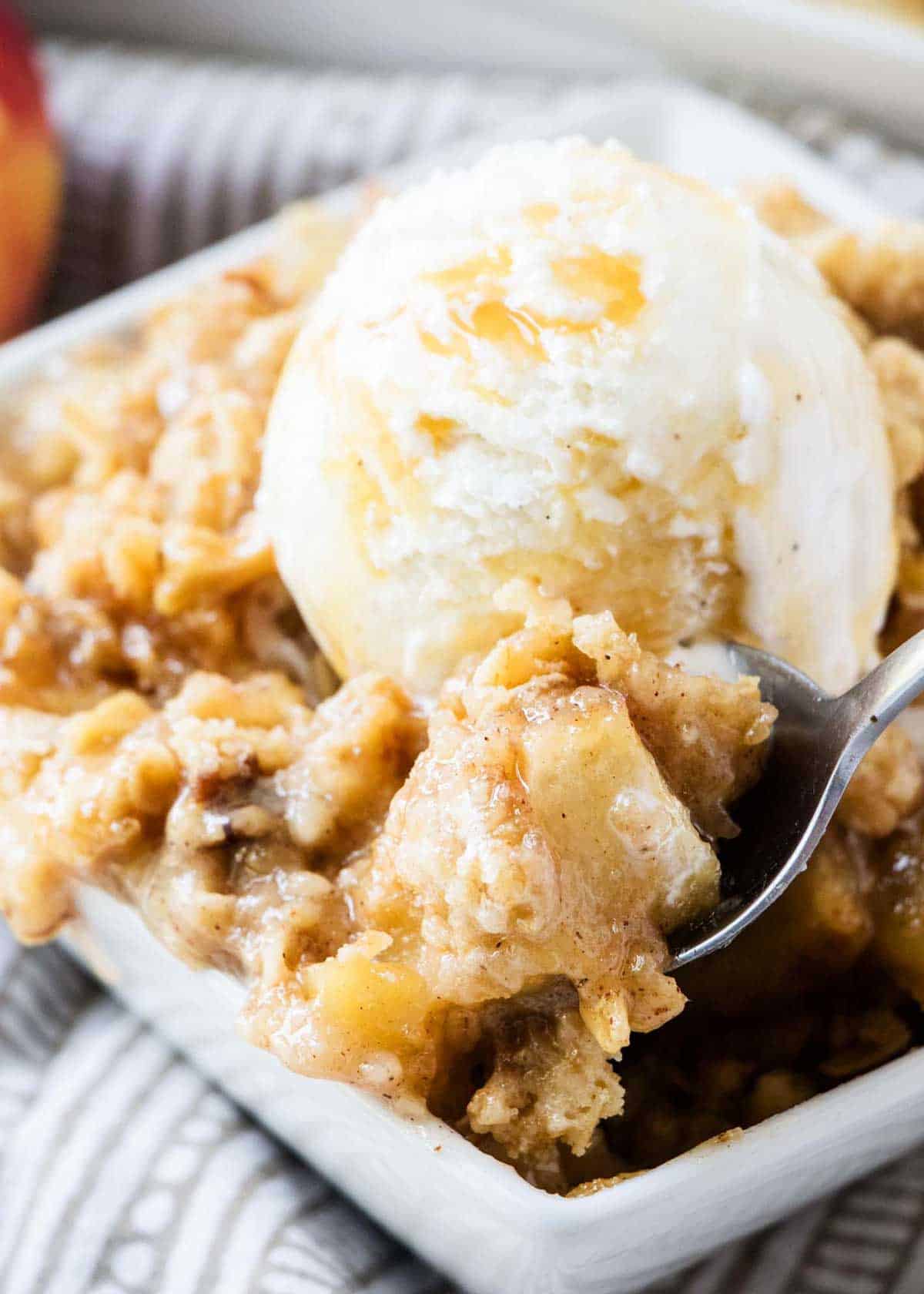 Spoonful of apple crisp.