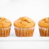 Pumpkin muffins on a white plate.