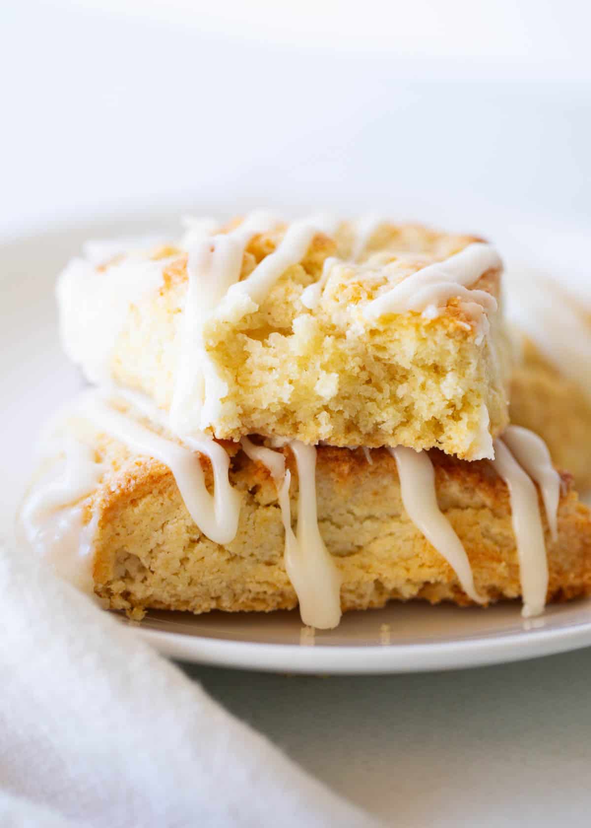 Stacked scones on a white plate.