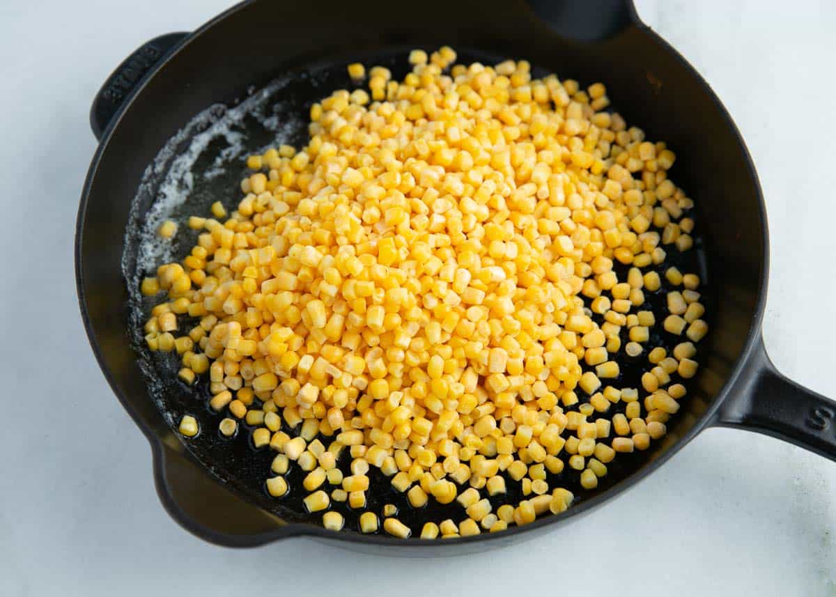 Corn cooking in the skillet. 