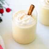 Eggnog in a glass cup.