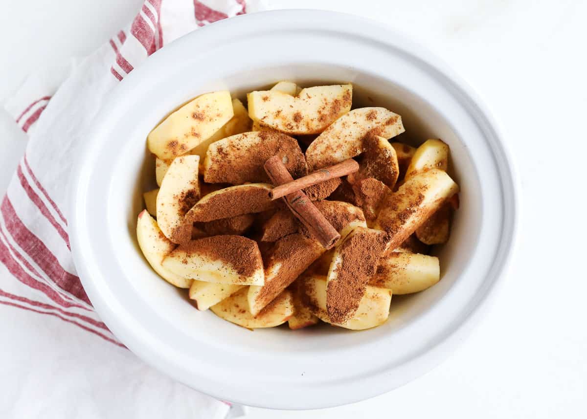 Showing how to make apple butter in a crockpot.