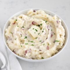 Mashed red potatoes in a bowl.