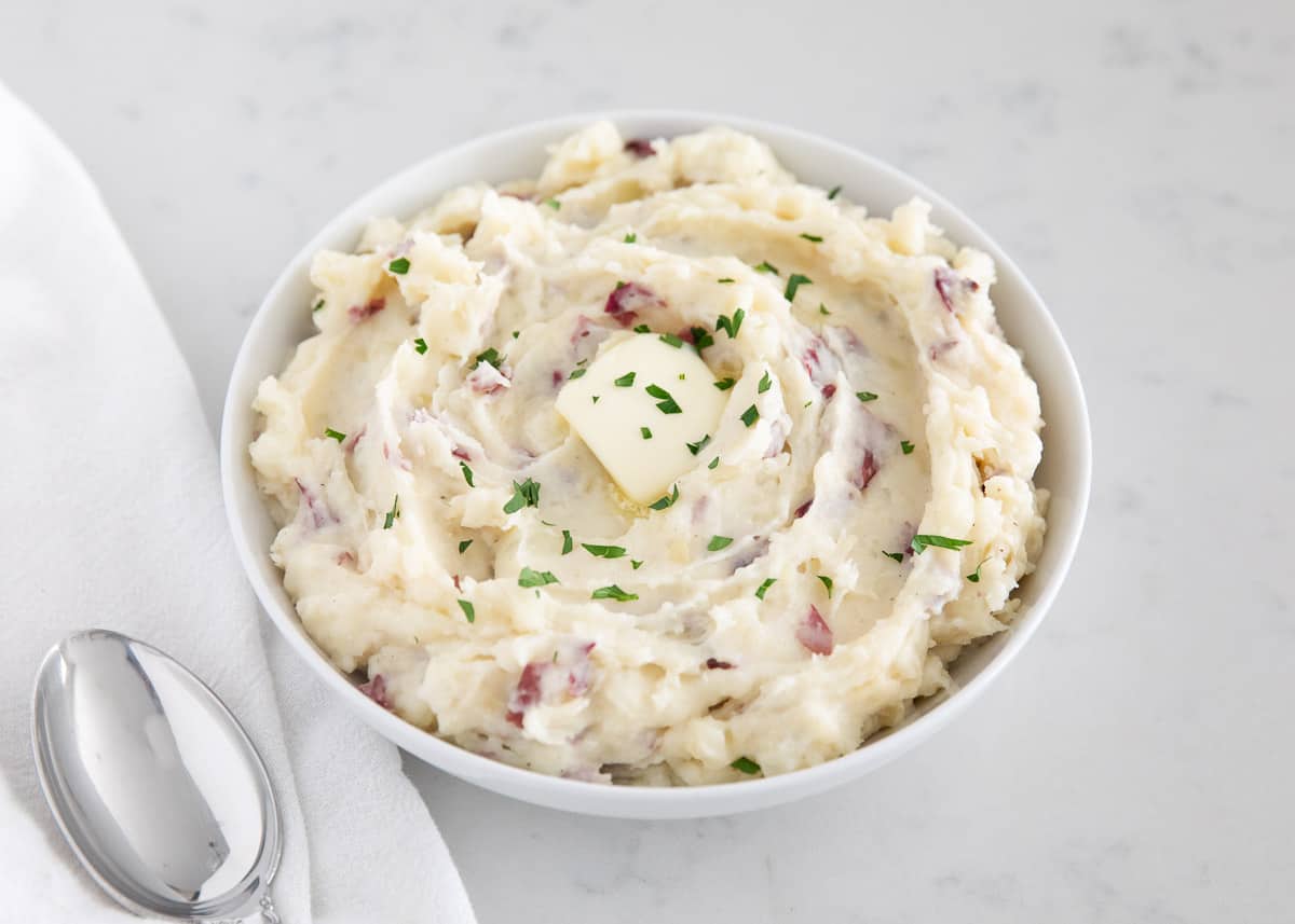 Mashed red potatoes in a bowl.