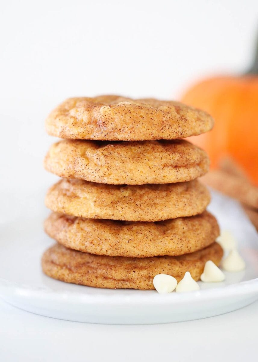 Stacked pumpkin snickerdoodles on a plate for a creative pumpkin dessert. 