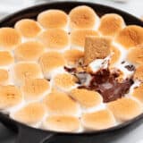 Smores dip cooked in a skillet.