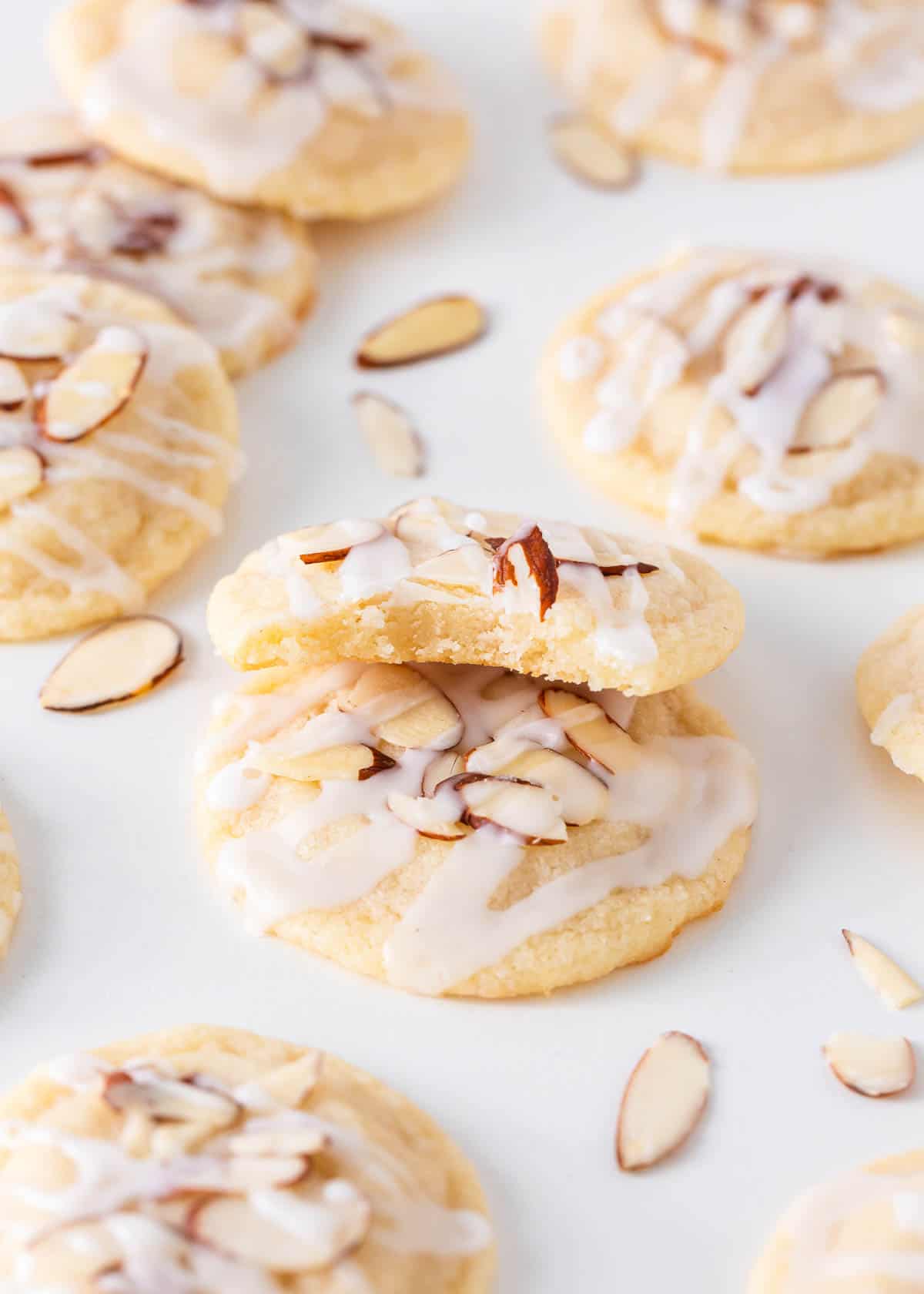 Stack of almond cookies on counter.