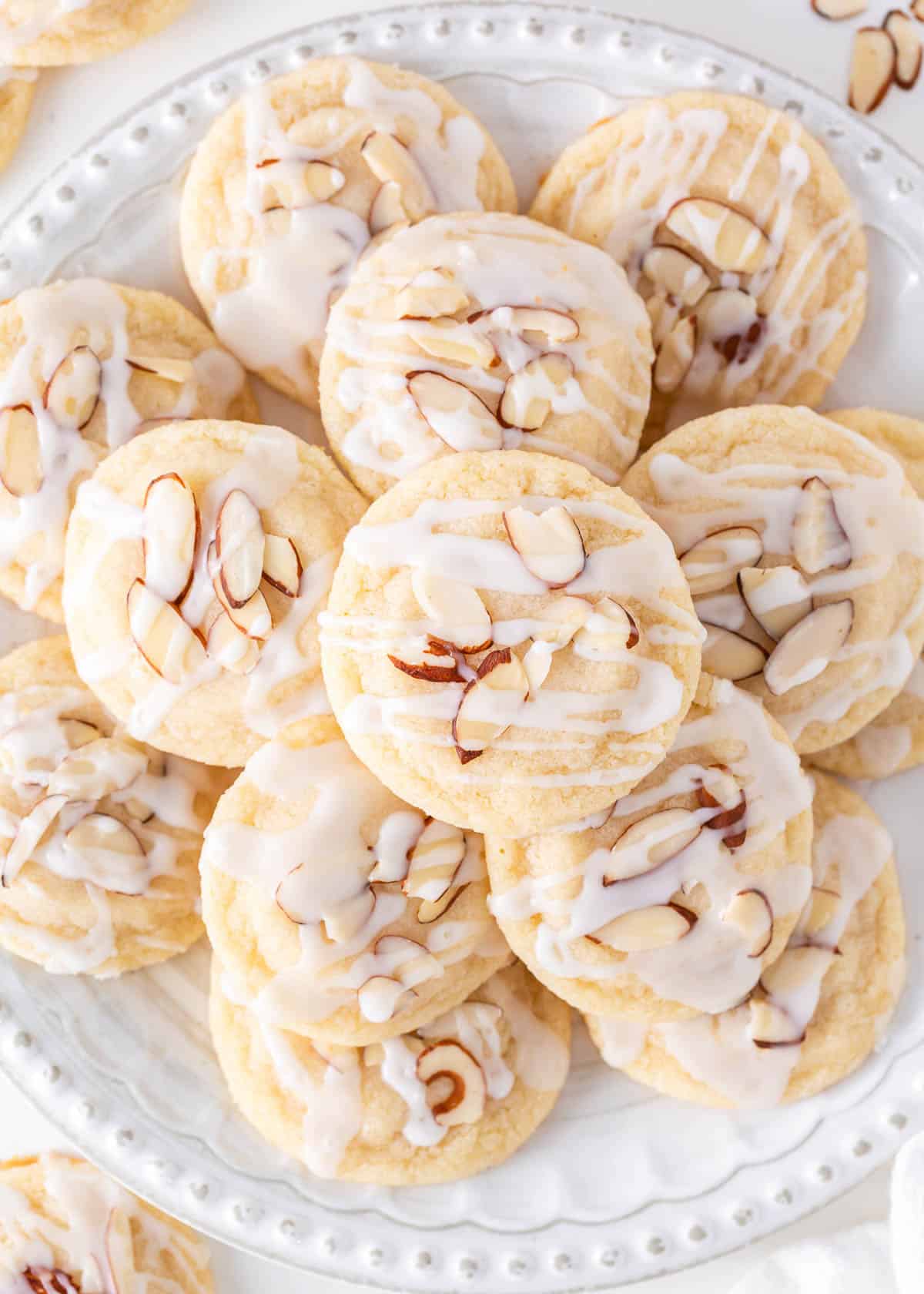 Almond cookies on a white plate.