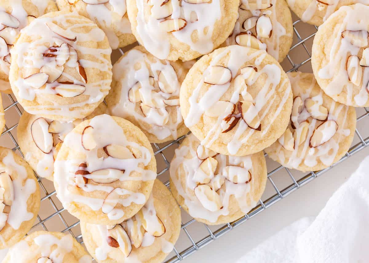 Almond cookies on a cooling rack.