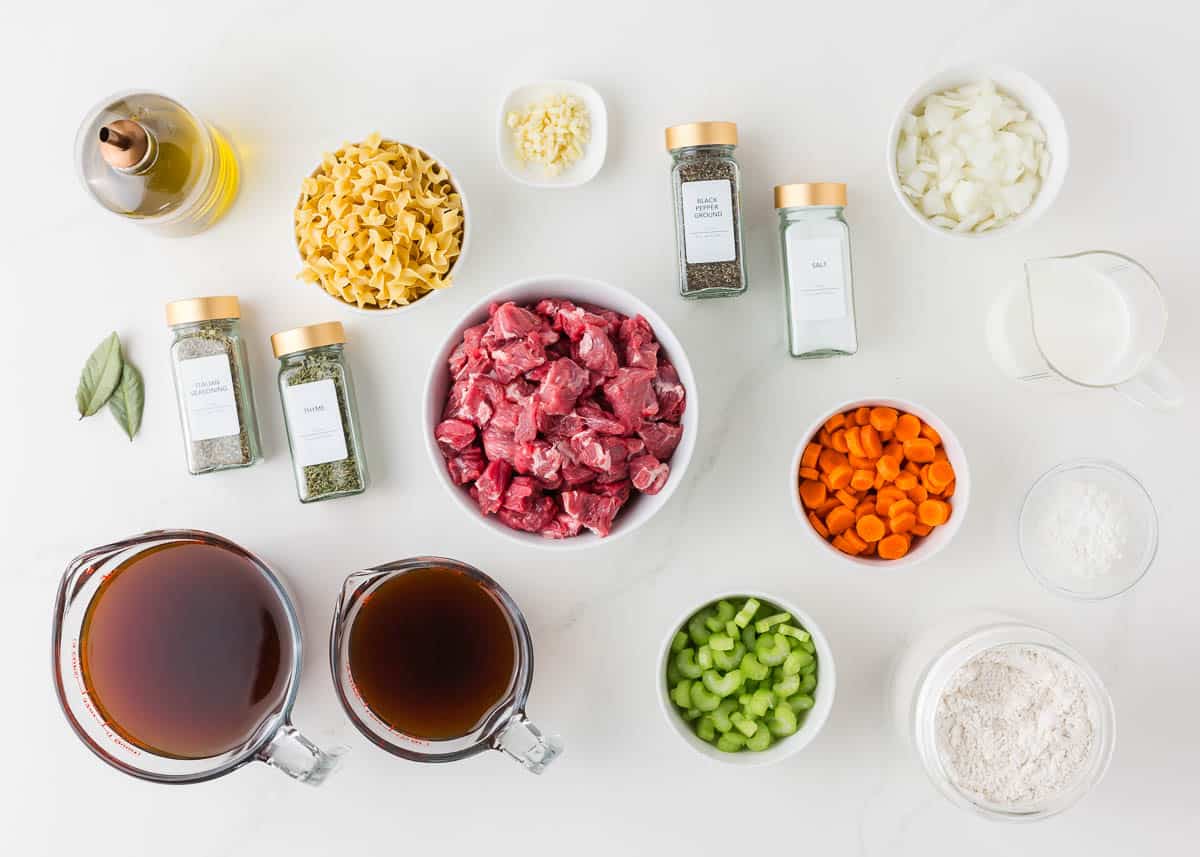 Beef noodle soup ingredients on the counter.