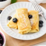 Blintzes on a white plate.