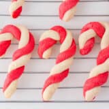 Candy cane cookies on a rack.