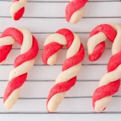Candy cane cookies on a rack.