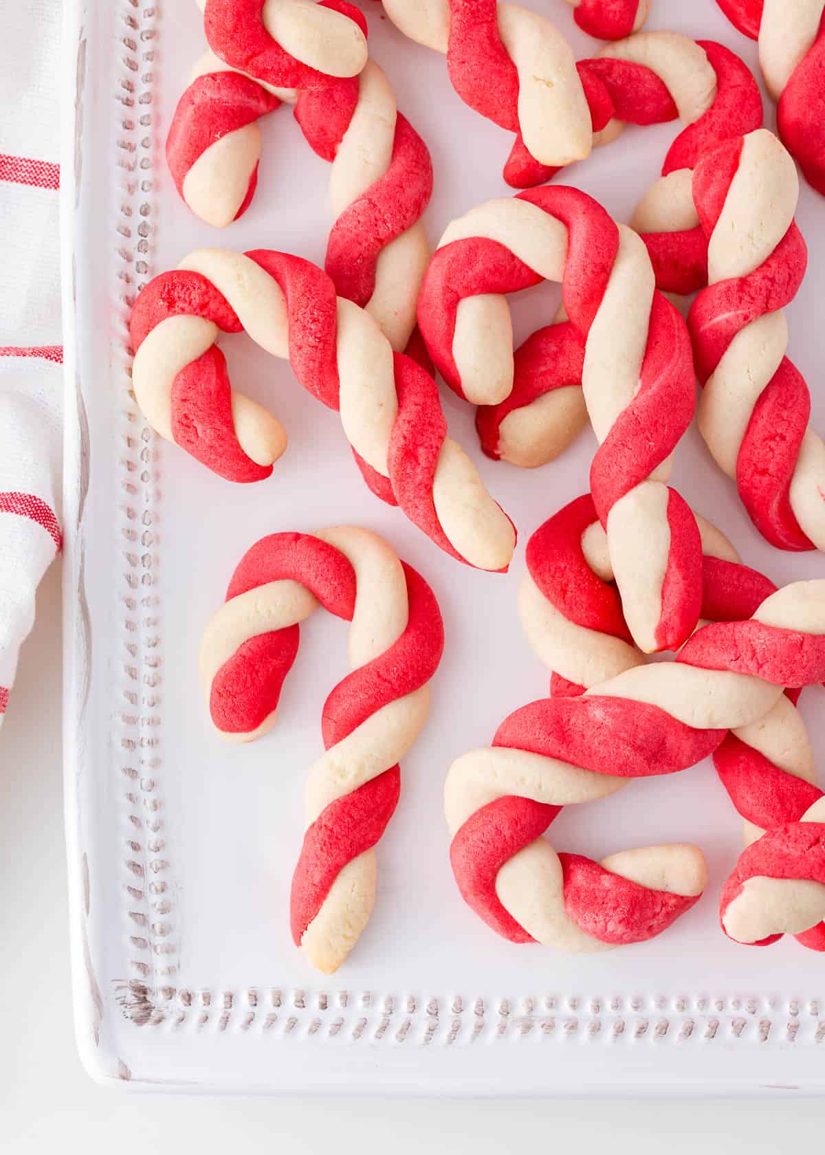 Candy cane cookies on a plate.