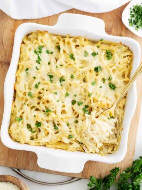 Turkey tetrazzini in a white baking dish.