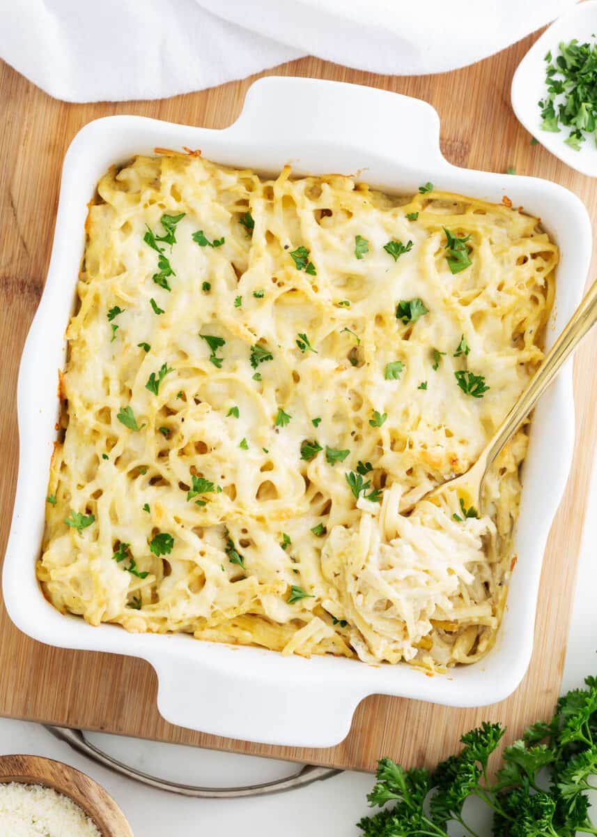 Turkey tetrazzini in a white baking dish.