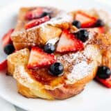 Sliced brioche french toast with berries.