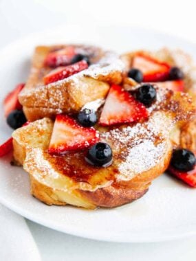 Sliced brioche french toast with berries.