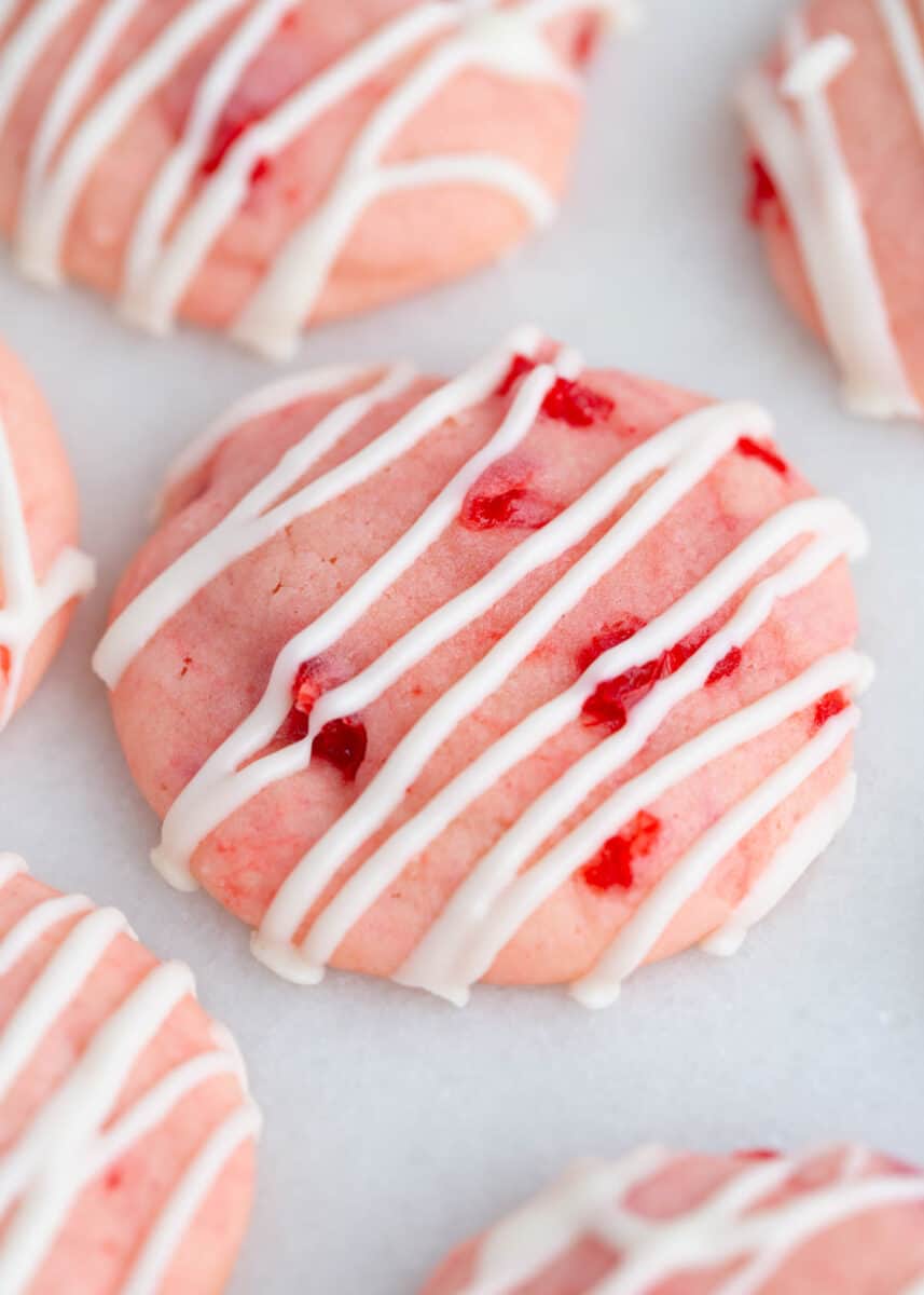 These cherry almond cookies are soft, buttery and bursting with cherry and almond flavor! These easy to make cookies are the perfect sweet treat and their bright red cherry pieces make them a hit at the holidays. Cherry cookies with white chocolate.