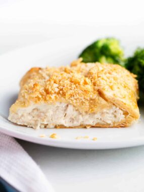 Chicken crescent roll on a white plate.