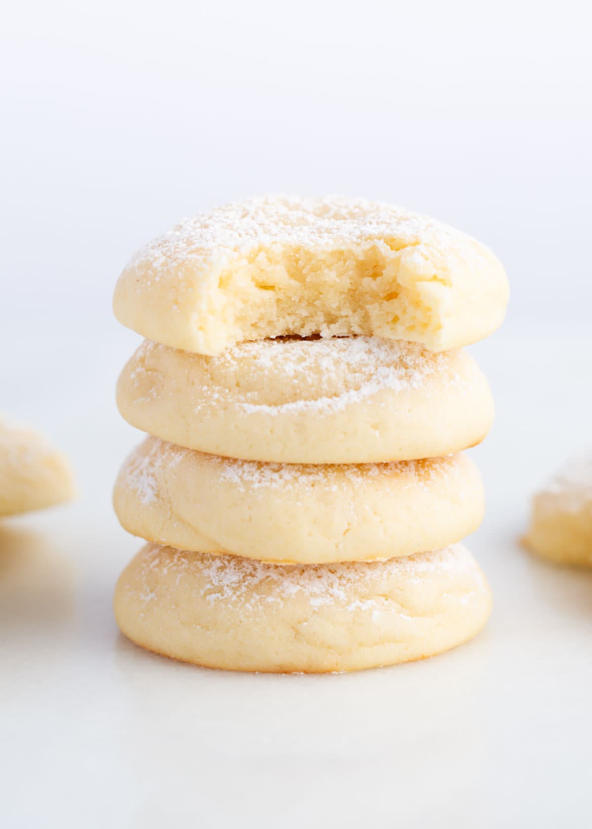 Stack of cream cheese cookies on counter.