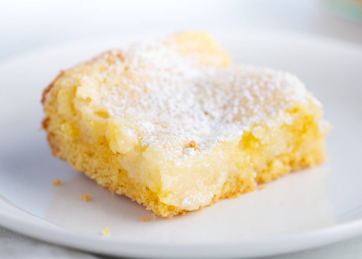 Slice of gooey butter cake on a plate.