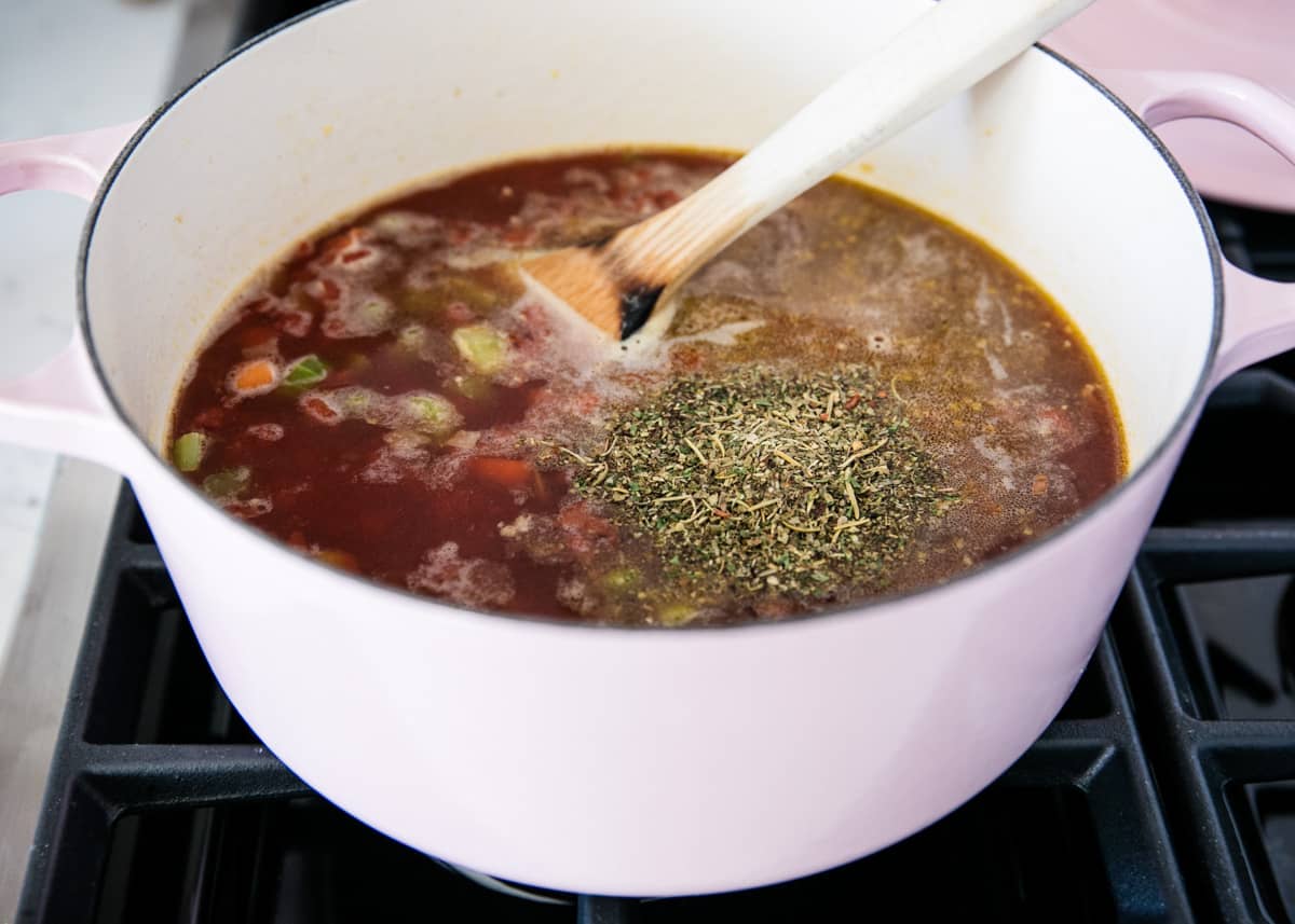 Showing how to make meatball soup in a pot.