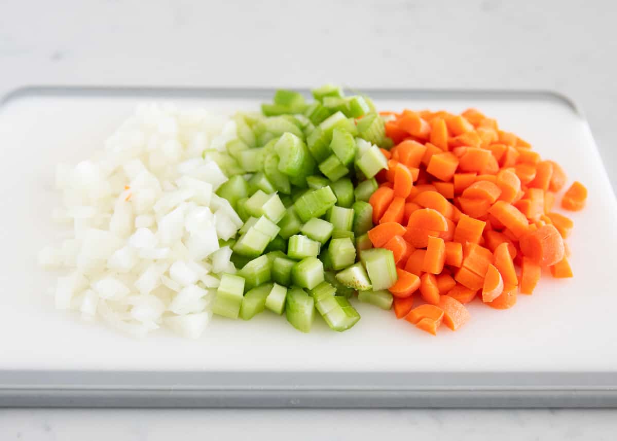 Cut veggies on cutting board.