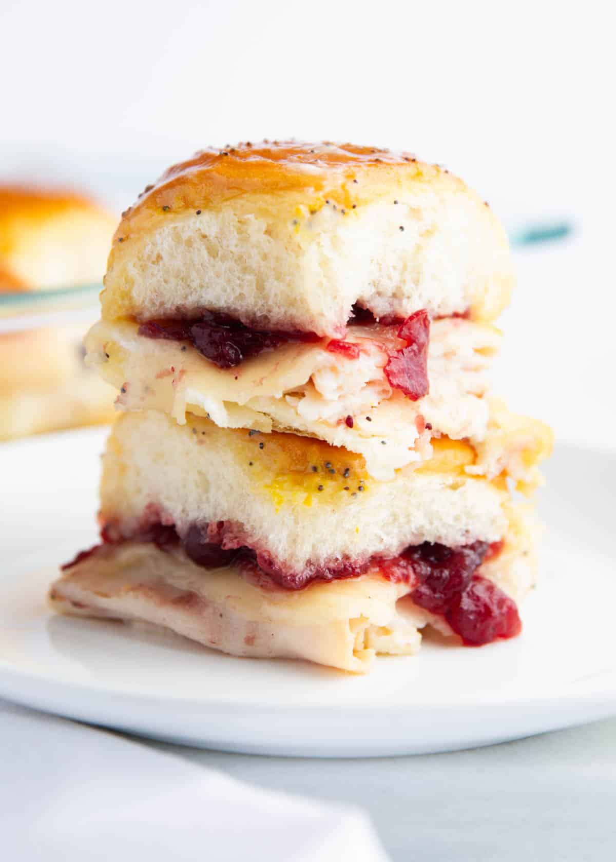 The best turkey cranberry sliders on a plate.