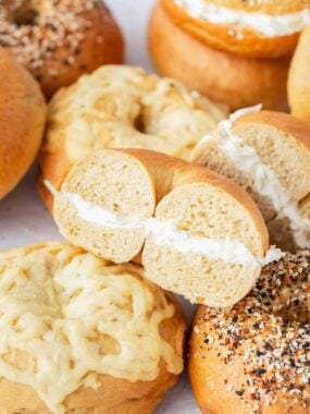 Stack of bagels with cream cheese.